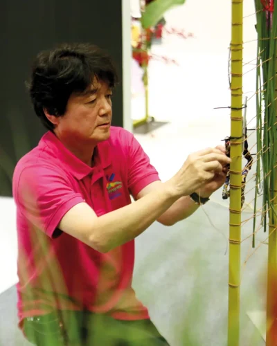 Hiroto Inoue, Japan, working on his design during the Floral Windows to the World Championship 1 CMYK300DPI