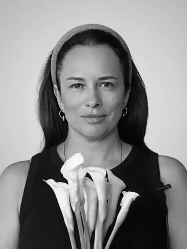 Olena Driuchan with a bunch of calla lilies