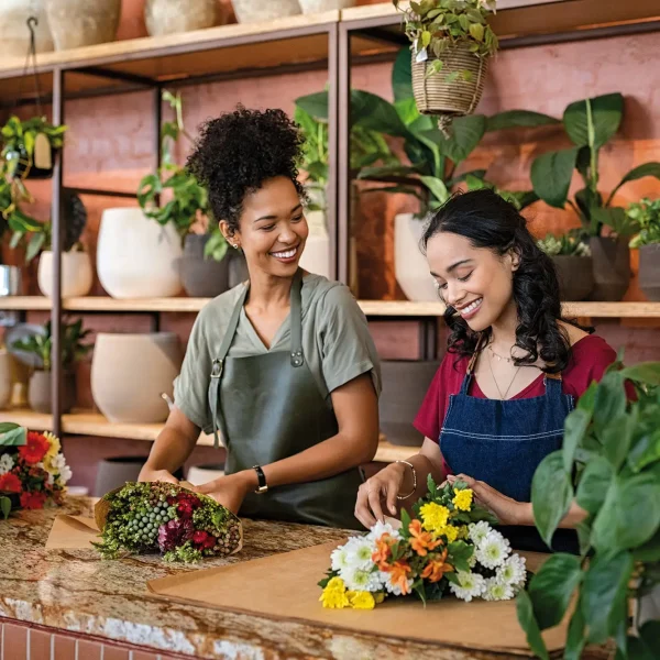 Two,Happy,And,Smiling,Young,Woman,Florist,Working,Together,In